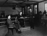 A witness testifies at the trial of 61 former camp personnel and prisoners from Mauthausen.