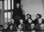 Hans Altfuldisch, stands in his place in the defendant's dock, at the trial of 61 former camp personnel and prisoners from Mauthausen.