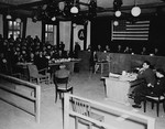 The tribunal hears the testimony of a witness at the trial of 61 former camp personnel and prisoners from Mauthausen.