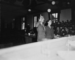A witness is sworn in at the trial of 61 former camp personnel and prisoners from Mauthausen.