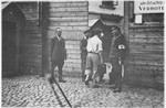 Jewish and Lithuanian police guard the entrance to the Vilna ghetto.