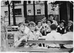 Children sit around a picnic table in a Jewish summer camp in Berlin

Felix Zajac is standing at the back.