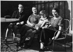 Gerhard Mahler shares an outdoor bench with his aunt, uncle, and nanny.