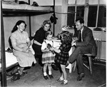 The Starkopf family visits with friends in the Feldafing displaced persons camp.