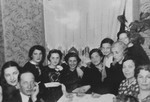 Members of the Fefer and Sztajman families at a gathering in the Fefer home in Lublin to celebrate the engagement (Tenayim) of Majer Sztajman and Sylka Fefer.