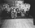 Members of the Ovici family, a family of Jewish dwarf entertainers known as the Lilliput Troupe, who survived Auschwitz, perform on stage.