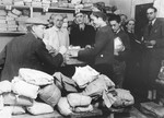 Jews line up to receive packages at the post office in the Opole Lubelskie ghetto.
