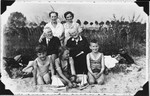 Fritz Glueckstein (bottom, left) poses on the beach with his Christian grandparents, aunt and cousins.