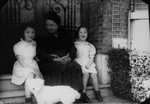 Margo and Annette Lederman, two Jewish children who lived in hiding with the van Buggenhout family during the war, pose with Clementine van Buggenhout, during a visit to her home after their removal to a Jewish orphanage.