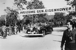 Neu Freimann residents greet General Dwight Eisenhower as his car drives into the displaced persons' camp.