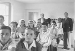 Students sit at their desks in a classroom at the Neu Freimann displaced persons camp.