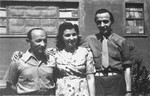 Three Jewish DPs pose outside at the Cinecitta displaced persons camp in Rome.