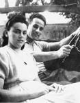 Max and Mardka Macher sit in a jeep outside the Stuttgart displaced persons camp.