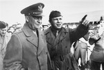 Camp director Saul Sorrin gives General Dwight Eisenhower a tour of the Neu Freimann displaced persons camp.