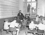Boys at the Jewish displaced persons camp in Wetzlar go to the synagogue to study Torah.