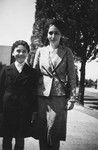 Elisabeth and Lux Adorno pose for a farewell portrait on a street in Frankfurt shortly before leaving for England on a Kindertransport.