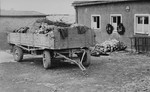 A wagon loaded with corpses intended for burial stands outside the crematorium in Buchenwald..