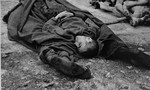 Corpses lie on the ground in Buchenwald.