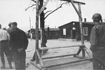 An American soldier views the gallows at the newly liberated Ohrdruf concentration camp during an inspection tour.