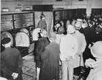 Civilians from nearby Weimar are forced by American soldiers to see the remains of prisoners in the crematorium ovens of Buchenwald during their tour of the concentration camp.