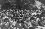 View of the audience at an outdoor meeting of Jewish DPs in the American Zone of Germany held in the Mittenwald displaced persons camp to commemorate the death march from Dachau to Tyrol.