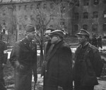 General Onslow S. Rolfe (left) and Dr. Samuel Gringaus (center) speak to Jewish DPs at the Landsberg displaced persons camp.