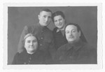 Postwar portrait of the Tenin family.

Pictuured are Moshe and Golda Tenin with their two surviving children, Boris and Klara.