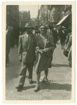 Rabbi and Mrs. Samuel Freilich walk down a street in Prague.