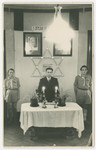 Jewish displaced persons conduct a memorial service to Theodore Herzl and Chaim Nachman Bialik in a convalescent home in Rome.