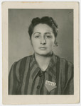 Ella Wieder Freilich poses in her concentration camp uniform after liberation.