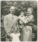 Rabbi and Mrs. Freilich pose with their two young children, Hadassah and Ary, in Gardener, MA.