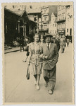 Rabbi and Mrs. Freilich walk down a street in Karlovy Vary (Carlsbad).