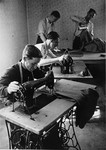Jewish men working in a sewing workshop in the Bindermichl DP camp.