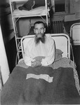 A half-starved survivor sits up in bed at the Hadamar Institute.