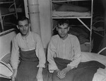 Two SS survivors of the Hadamar Institute sit on a bed at the former euthanasia facility.