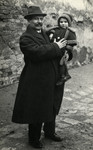 Wilhelm Steiner holds his baby daughter Reline.