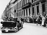 Cheering Berliners greet Adolf Hitler in front of the chancellery as he travels to the Kroll Opera House for the opening of the first working session of the Reichstag two days after the ceremonial opening in Potsdam.