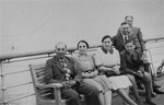 A Jewish refugee family from Germany poses on the deck of the SS Rotterdam while en route to New York.