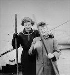Two Jewish refugee siblings from Vienna pose on board the SS Pennland of the Holland-America Line, while en route to the U.S.