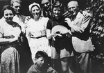 Members of a Jewish refugee family from Vienna pose outside with their sponsor.