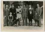Group portrait of the Galicki and Kolman families in the Ulm displaced persons camp.