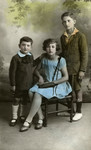 Colorized studio portrait of three Jewish siblings in Paris.