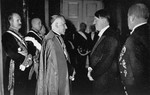 Adolf Hitler converses with the Papal Nuncio, Archbishop Cesare Orsenigo, at a New Year's reception in Berlin.