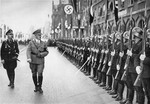 Adolf Hitler and Heinrich Himmler review the SS Leibstandarte "Adolf Hitler" in a ceremony at the seventh Reichsparteitag (Reich Party Day) in Nuremberg.