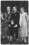 Portrait of the Zamojre family.

Pictured from left to right are Elinor Zamojre, Markus Zamojre with his son Joseph, and Miriam Wiesenthal (Elinor's sister).