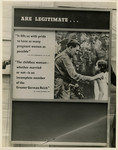 Panel from a 1944 exhibition in London, England entitled "Germany- the Evidence" showing Adolf Hitler greeting a young girl in a crowd.
