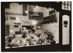 View of the entrance and display window of the Baergo butcher shop in Amsterdam, owned by Ernst Baer, a German Jewish emigre.