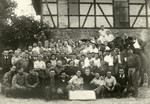 Group portrait of Zionist youth and American soldiers in Kibbutz Buchenwald