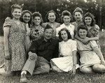 Rabbi Robert Marcus poses with young women from Kibbutz Buchenwald.