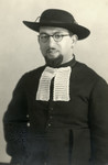 Studio portrait of Rabbi Moise Cassorla (father of the donor) in rabbinical attire.